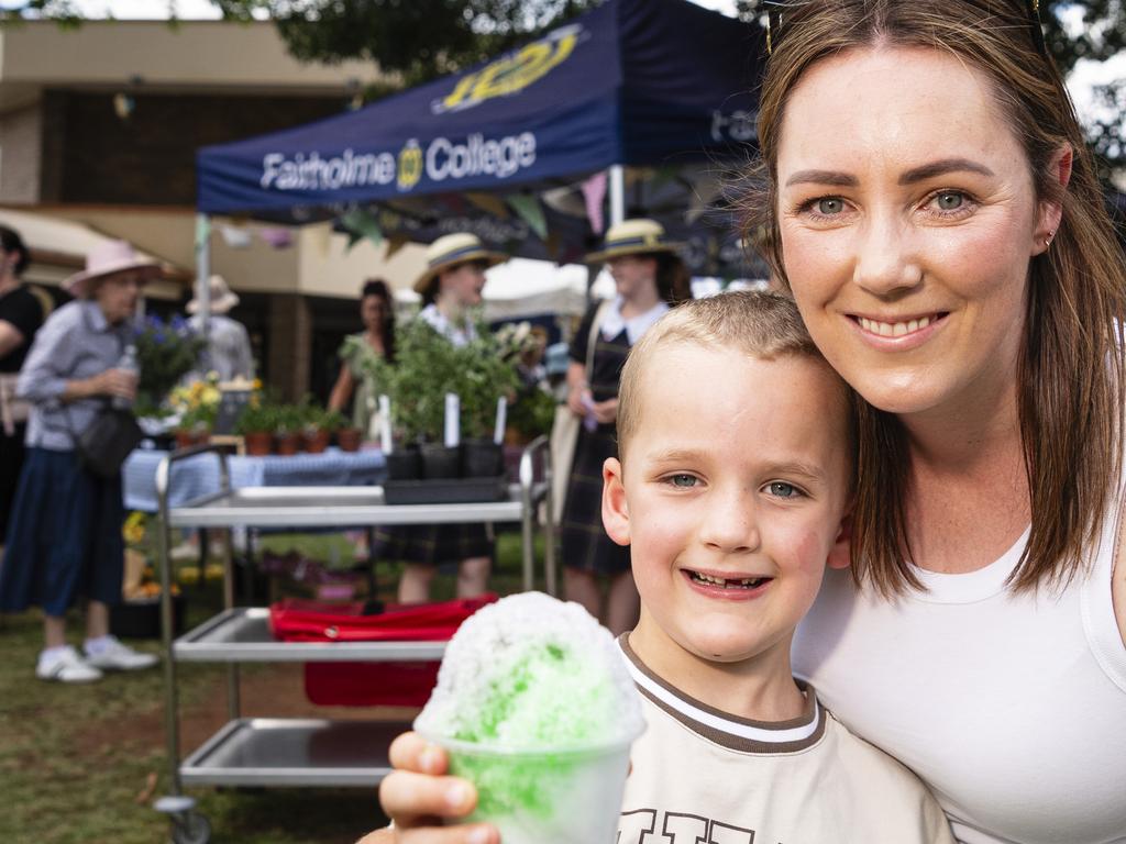 Edward and Georgia Cook as Edward cools down with a snow cone at Fairholme Spring Fair, Saturday, October 19, 2024. Picture: Kevin Farmer