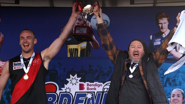 Riddell captain Joshua Grabham and coach Justin Belleville celebrate last year’s premiership. Photo: Hamish Blair