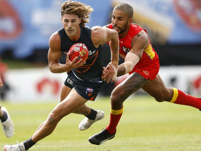 Giants James Peatling and Suns' Touk Miller during the AFL Gather Round match between the GWS Giants and Gold Coast Suns at Mount Barker, Adelaide on April 7, 2024.  Photo by Phil Hillyard(Image Supplied for Editorial Use only - **NO ON SALES** - Â©Phil Hillyard )