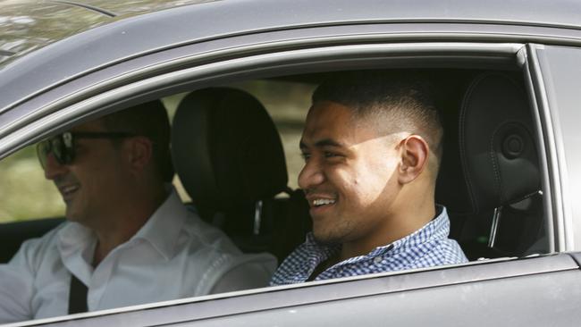 Fainu smiles as he is driven away from Parklea Correctional Centre.