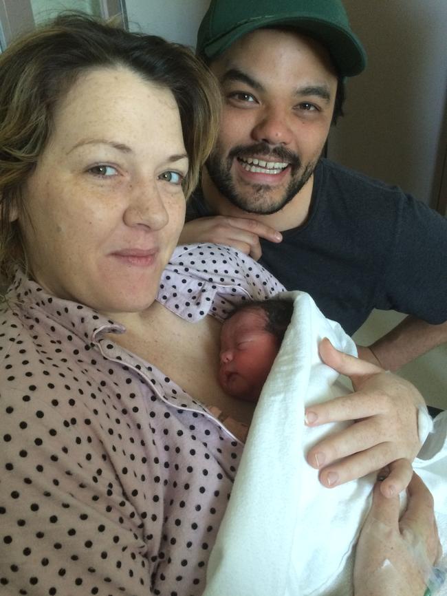 Parents Courtney and Jake Jauhari with one of their twin boys. Picture: Supplied