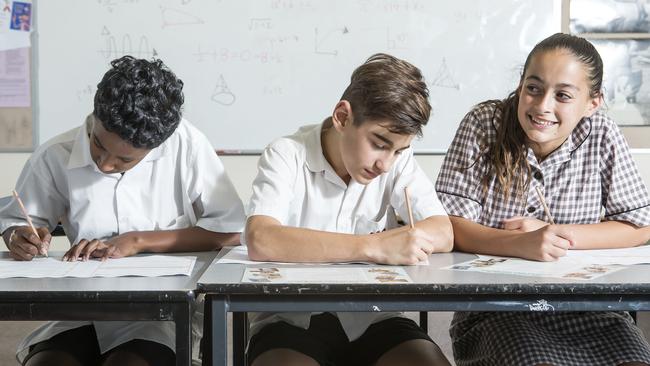 Glen Eira college year 7's will  trial online NAPLAN next year.This years 7 will be still using the old pencil and paper. L-R 12 Vishal Shanmugam,12, Zac La Sala,13 and Jenna Casamento. Picture Sarah Matray