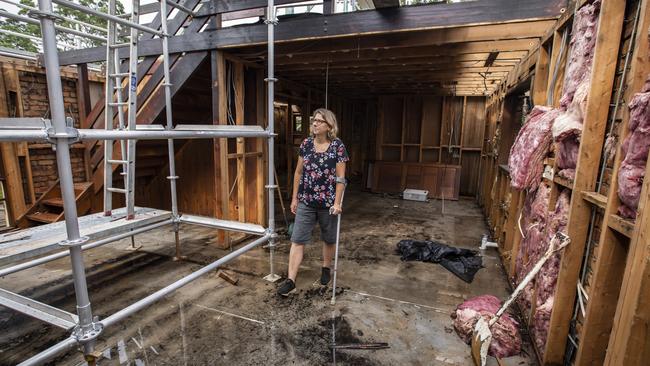 Cal McKinnon in the shell of her house after an ember attack created an internal fire. Picture: Mark Cranitch