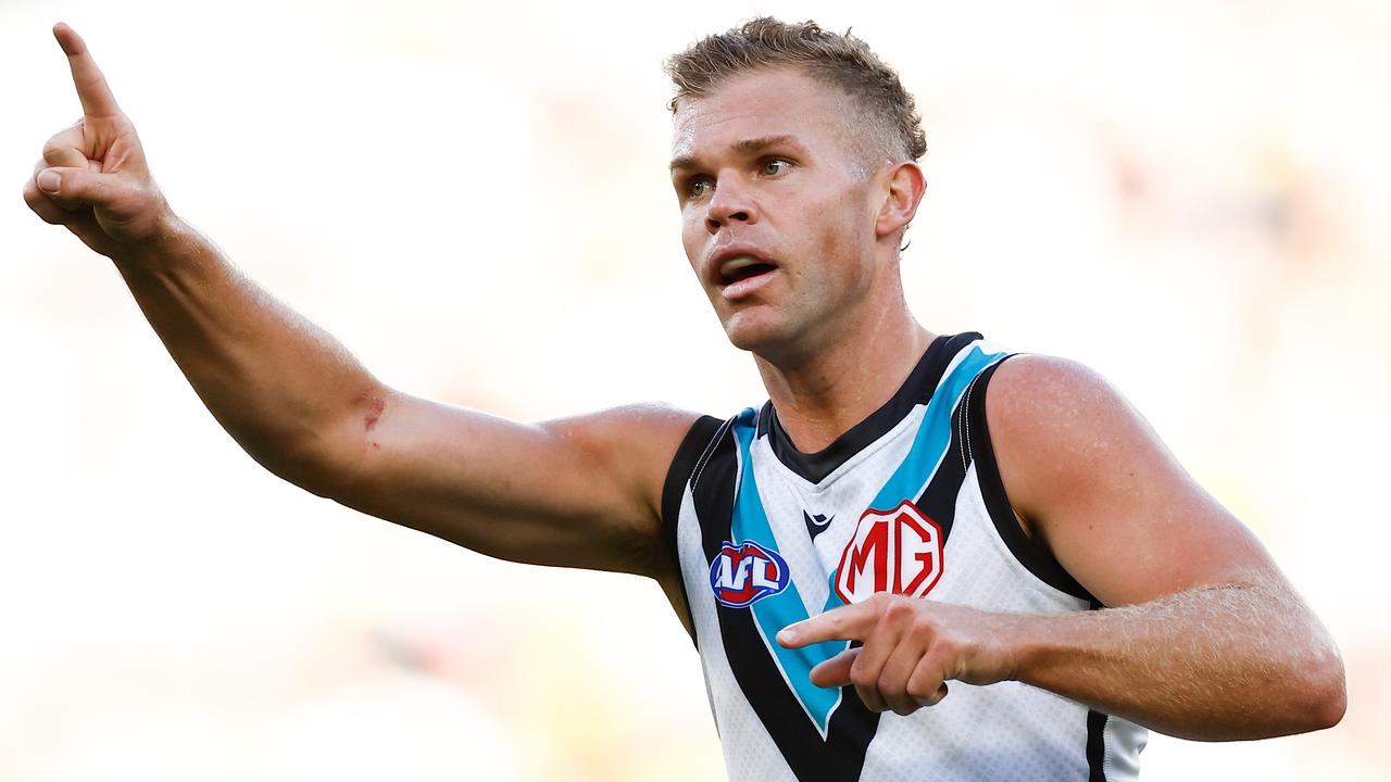 MELBOURNE, AUSTRALIA - MARCH 24: Dan Houston of the Power celebrates a goal during the 2024 AFL Round 02 match between the Richmond Tigers and the Port Adelaide Power at the Melbourne Cricket Ground on March 24, 2024 in Melbourne, Australia. (Photo by Michael Willson/AFL Photos via Getty Images)