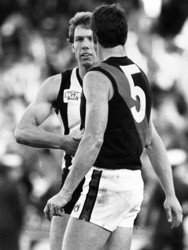 Gavin Brown shakes hands with Terry Daniher after the final siren.