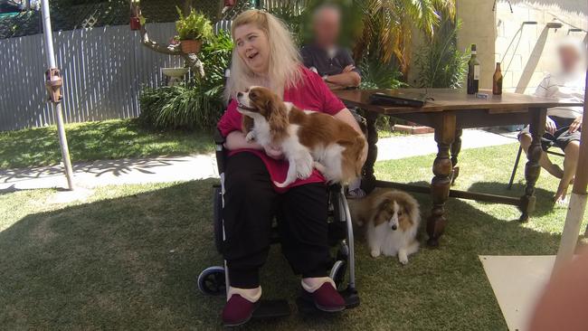 Ann Marie Smith happy at a social occasion in 2011, with her dogs Maggie and Deana. Picture: SAPOL