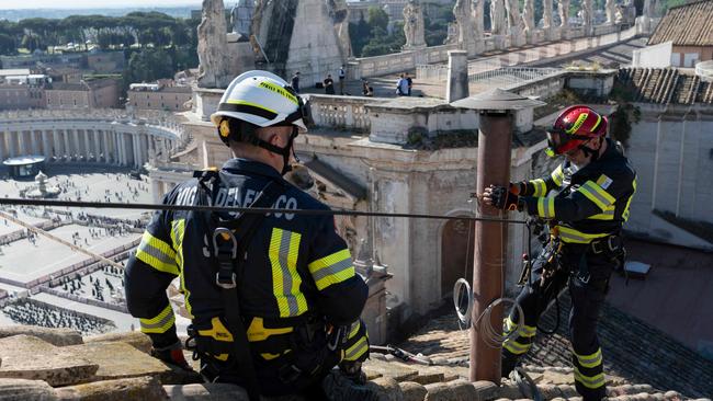 The setting up of the Sistine Chapel and installation of the chimney before the start of the conclave. Picture: Vatican Media/AFP