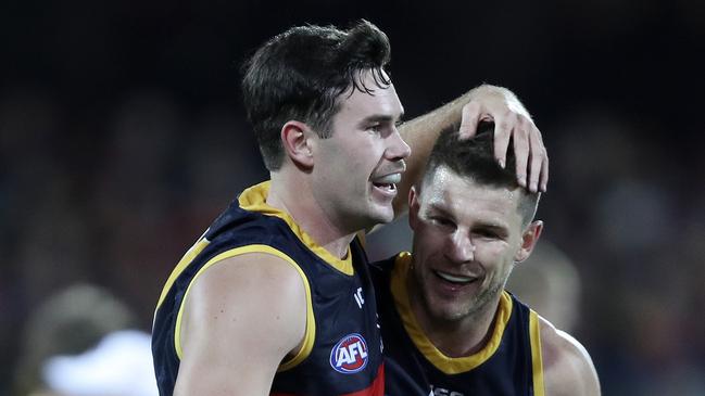 Mitch McGovern congratulates Bryce Gibbs on a goal in his first year at the Crows from Carlton. McGovern is now heading to the Blues. Picture Sarah Reed