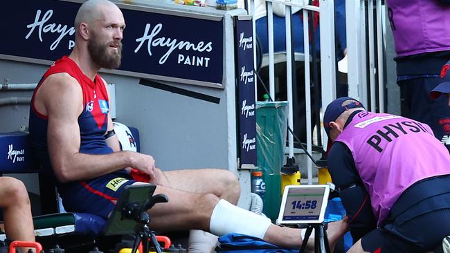 MELBOURNE, AUSTRALIA - JULY 07: Max Gawn of the Demons receives attention during the round 17 AFL match between Melbourne Demons and West Coast Eagles at Melbourne Cricket Ground on July 07, 2024 in Melbourne, Australia. (Photo by Graham Denholm/AFL Photos/via Getty Images)