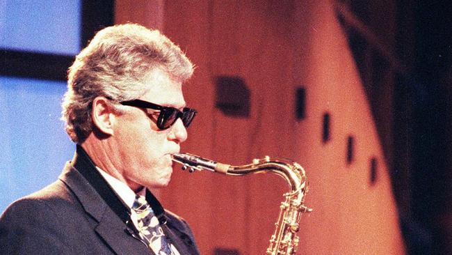 3/6/1992 - USA politician Governor of Arkansas Bill Clinton (later President) playing saxophone on Arsenio Hall's late-night TV show in Los Angeles.