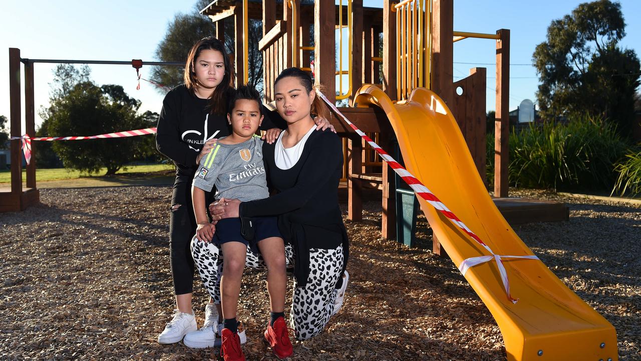 Nita O’Hara with Shanika, 11, and Phoenix, 6, who are devastated their next-door playground is off limits. Picture: Josie Hayden