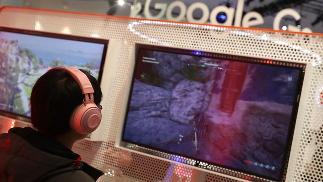 Attendees play games on the new Stadia gaming platform at the Google booth at the 2019 GDC Game Developers Conference in San Francisco, California in March. Picture: AP