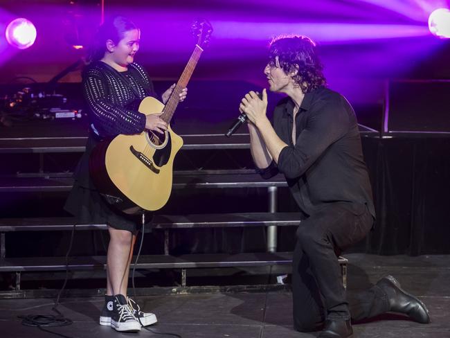 Ella Pedder 9 of Hobart on stage with Dean Lewis at MyState Bank Arena Hobart.  Picture: Caroline Tan for Dean Lewis