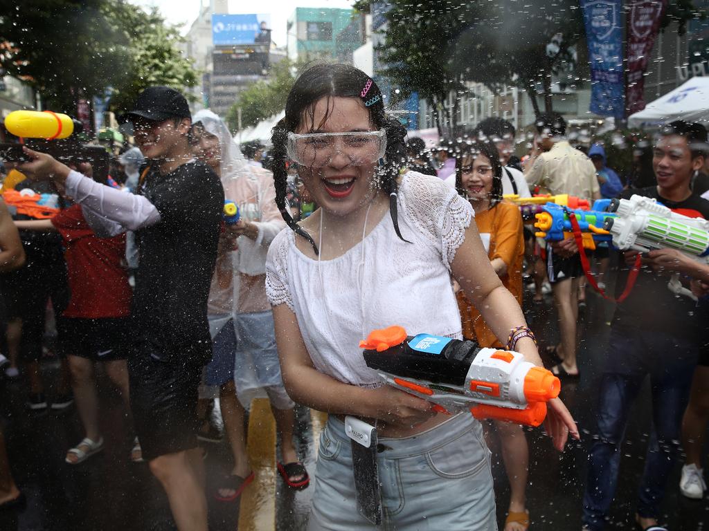 Participants spray each other during the Water Gun Festival in Seoul, South Korea. Picture: Getty Images