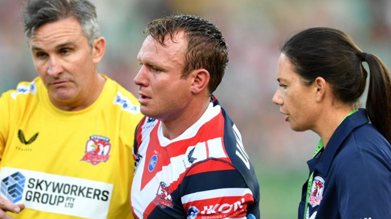 Roosters captain Jake Friend leaves the field concussed on Saturday.