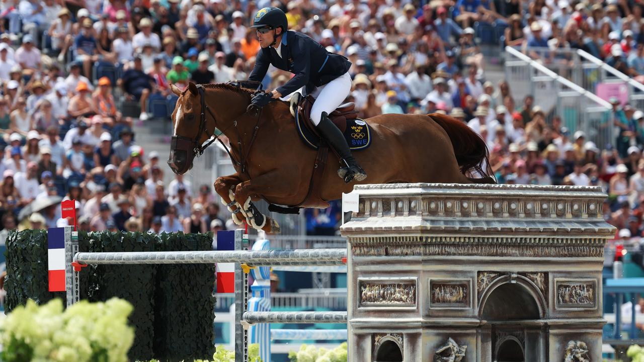 Henrik Von Eckermann and horse King Edward of Team Sweden jump over the Arc de Triomphe tribute. Picture: Getty Images