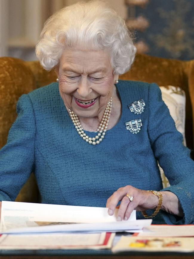 Queen Elizabeth II views a display of memorabilia from her Golden and Platinum Jubilees in the Oak Room at Windsor Castle earlier this month. Picture: Steve Parsons-WPA Pool/Getty Images