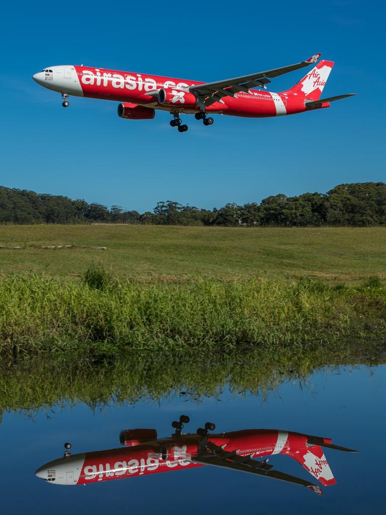 Reflections of Air Asia. Photo: David Dickie