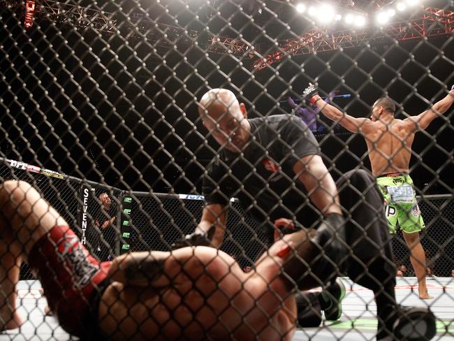 Thiago Santos, right, raises his hands after his TKO win over Andy Enz.