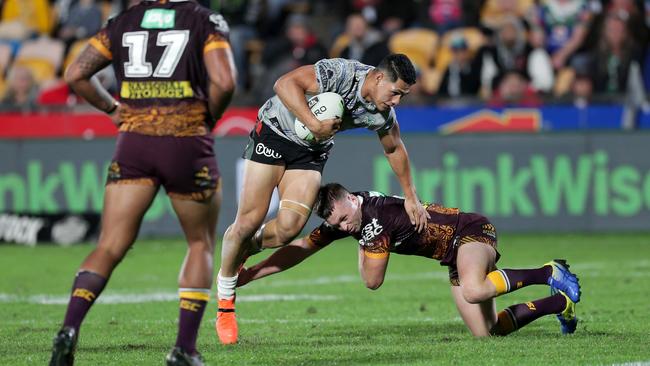 Jake Turpin does the job on Roger Tuivasa-Sheck. Image: AAP Image/David Rowland