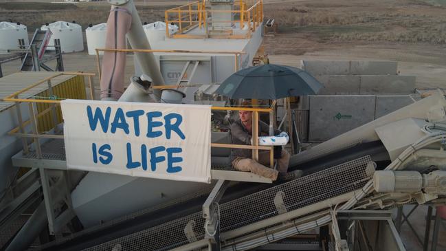 Nelly Bay man Barney Jackson, 23, has been charged after allegedly locking himself to machinery and stopping construction work at Bravus Mining’s rail construction site.