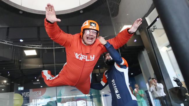 Mayor Tom Tate takes flight. Pictured above learning how to indoor skydive at iFLY in Surfers Paradise with instructor Mike Brigg. Picture: Glenn Hampson