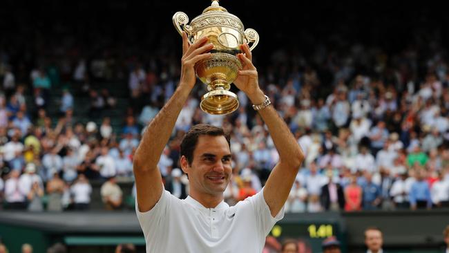 Switzerland's Roger Federer holds the winner's trophy after beating Croatia's Marin Cilic.