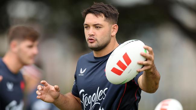 Brandon Smith handles the ball during a Sydney Roosters NRL training