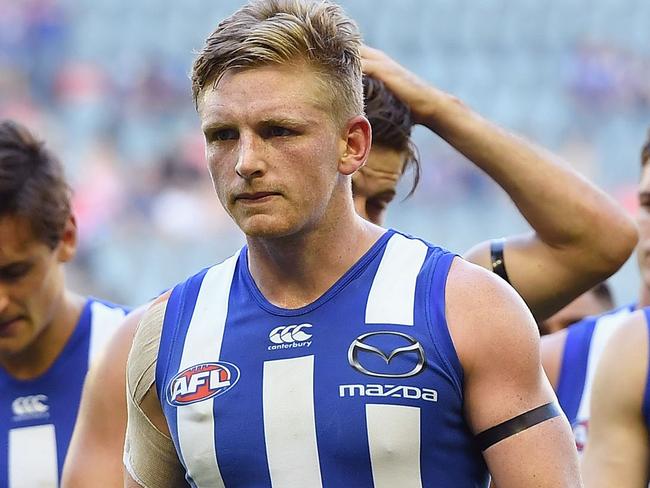 MELBOURNE, AUSTRALIA - MARCH 26: The Kangaroos look dejected after losing the round one AFL match between the North Melbourne Kangaroos and the West Coast Eagles at Etihad Stadium on March 26, 2017 in Melbourne, Australia. (Photo by Quinn Rooney/Getty Images)