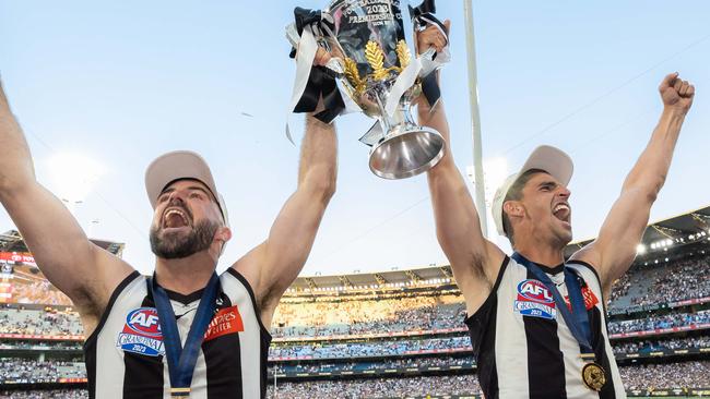 MELBOURNE , AUSTRALIA. September 30, 2023. AFL Grand Final between Collingwood and the Brisbane Lions at the MCG. After the siren, Collingwood wins. Steele Sidebottom and Scott Pendlebury. Picture by Jason Edwards