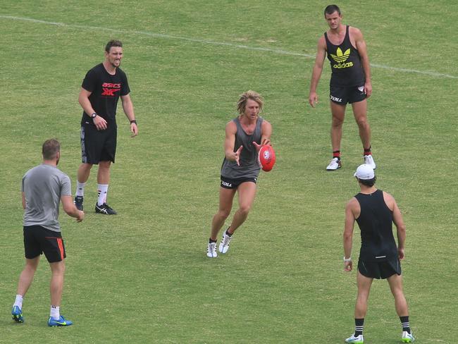 Dyson Heppell (middle) has been training with his banned teammates. Picture: Hamish Blair