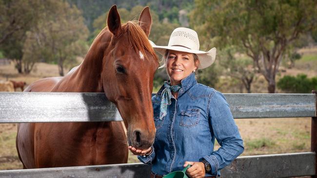 Shine - Cattle producer Felicity Burton with Elsola Rey (Chestnut Mare) at Cooranga North on their (Karl Burton) property Cyprus (50km south of Kingaroy). Felicity led the acquisition of three units (in Toowoomba) for emergency housing for families that have children in extended hospital visits. Photo: David Martinelli.
