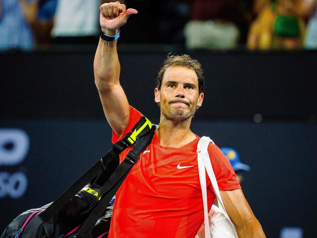 TOPSHOT - Spain's Rafael Nadal reacts as he leaves the court after his loss against Australia's Jordan Thompson at their men's singles match during the Brisbane International tennis tournament in Brisbane on January 5, 2024. (Photo by Patrick HAMILTON / AFP) / --IMAGE RESTRICTED TO EDITORIAL USE - STRICTLY NO COMMERCIAL USE--