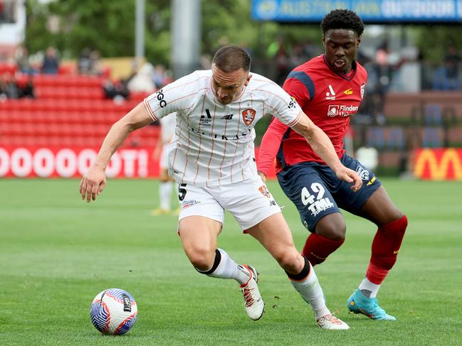 Tom Aldred (left) hopes to remain with Brisbane Roar next season. Picture: James Elsby/Getty Images