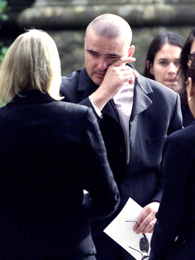 Matthew Wales crying at funeral of his mother and stepfather in 2002.