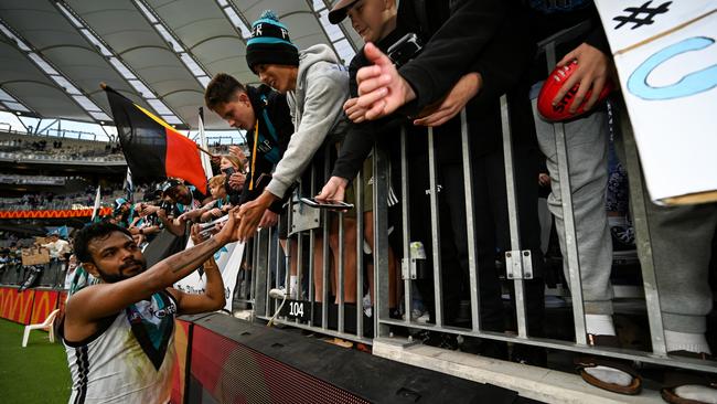 Rioli celebrates a win with Power fans after the round 23 match against the Fremantle Dockers. Picture: Getty Images