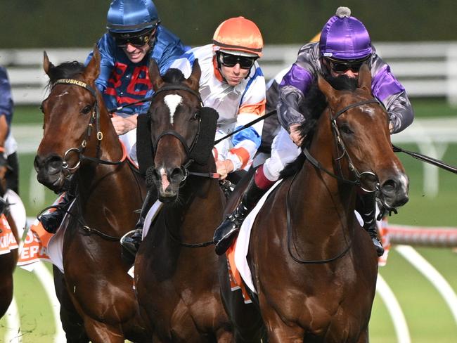 MELBOURNE, AUSTRALIA - OCTOBER 14: Ben Melham riding Griff defeats Damian Lane riding Veight and Steparty in winning Race 9, the Neds Caulfield Guineas, during Melbourne Racing at Caulfield Racecourse on October 14, 2023 in Melbourne, Australia. (Photo by Vince Caligiuri/Getty Images)