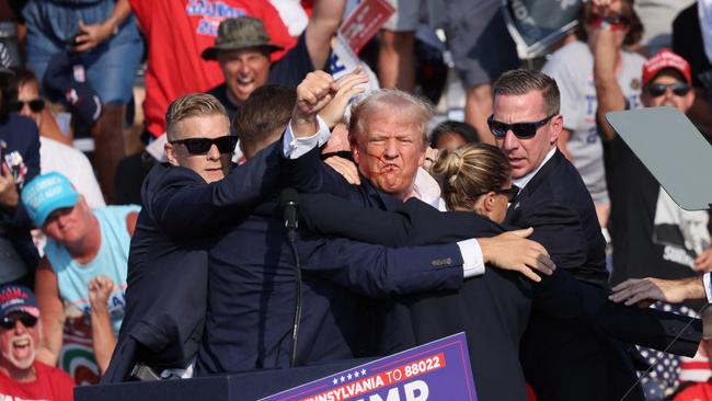 Donald Trump gestures to supporters following the assassination attempt. Picture: Reuters