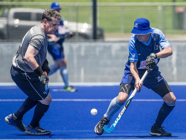 Action in the Pan Pacific Masters Games Hockey tournament. Picture: Glenn Campbell