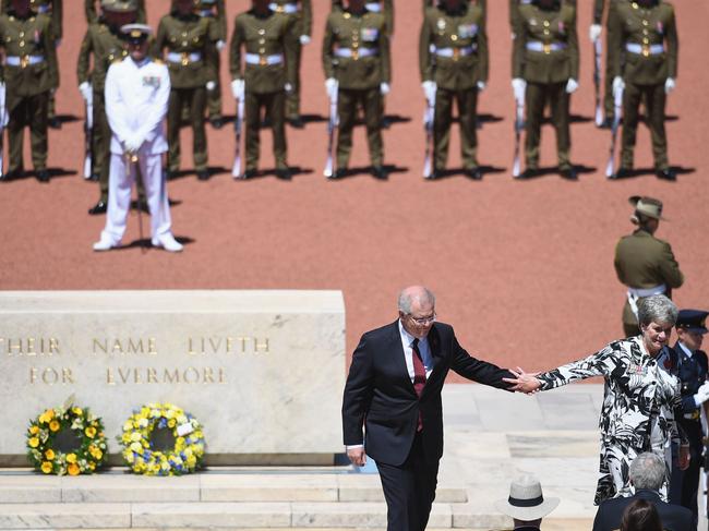 CANBERRA, AUSTRALIA - NOVEMBER 11:  Australian Prime Minster Scott Morrison and the National President of the War Widows' Guild Of Australia Meg Green (R) lay a wreath during the Remembrance Day Service at the Australian War Memorial on November 11, 2018 in Canberra, Australia. Remembrance Day 2018 marks the centenary anniversary of the Armistice that ended the First World War on 11 November 1918. Almost 62,000 Australians died fighting in four years of global conflict. On this day Australians observe one minute's silence at 11 am to honour those who have served and those who have died in war and on peacekeeping and humanitarian operations.  (Photo by Tracey Nearmy/Getty Images)