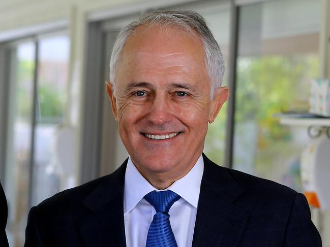 Prime Minister Malcolm Turnbull and Federal Member for Forde Bert van Manen (left) speak to media during a visit to Amaze Early Learning Centre, Ormeau, Gold Coast, Thursday, July 12, 2018. (AAPImage/David Clark) NO ARCHIVING