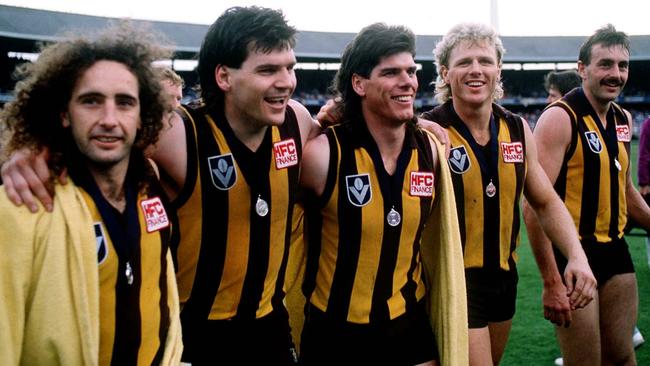 (From left) John Platten, Jason Dunstall, Norm Smith Medal winner Gary Ayres, Dermott Brereton and John Kennedy after Hawthorn’s Grand Final win in 1986. Picture: Tony Feder/ALLSPORT