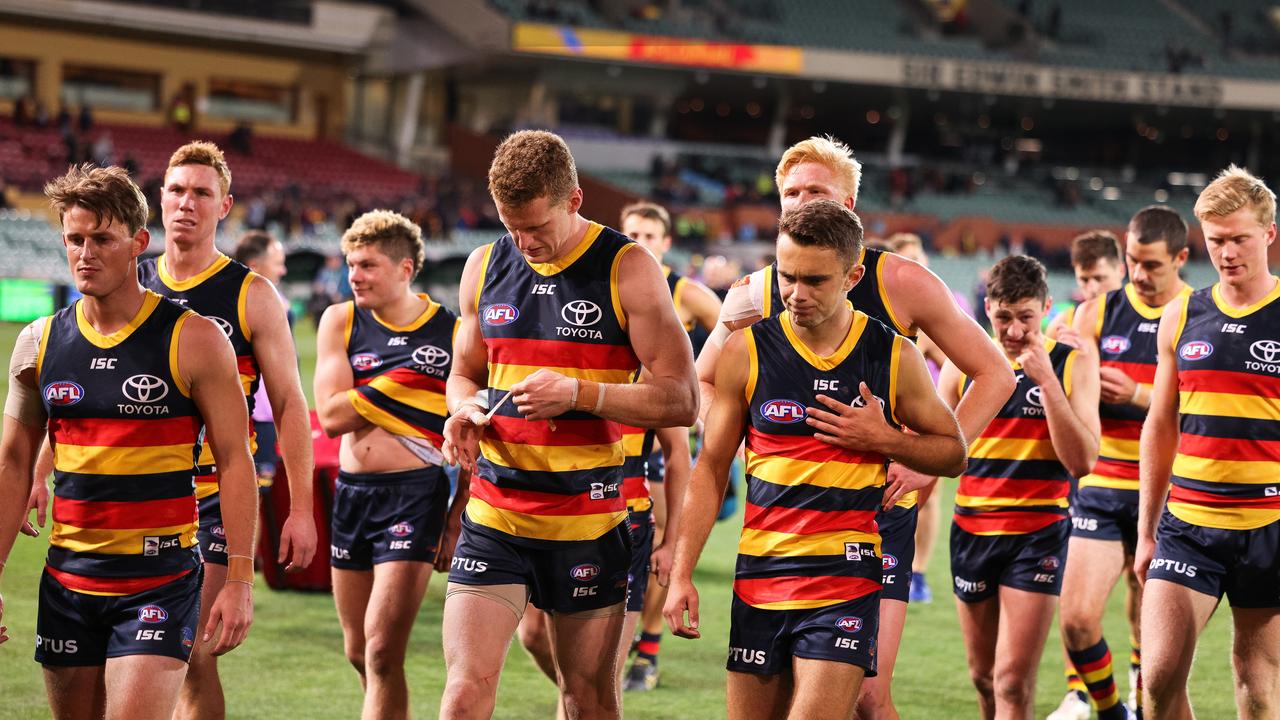 Crows players walk from the ground dejected after Wednesday night’s 51-point loss to Melbourne. Picture: Daniel Kalisz/Getty Images