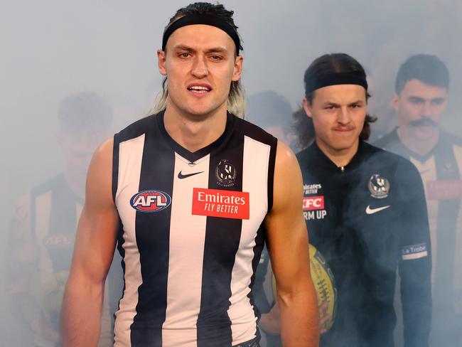 MELBOURNE, AUSTRALIA - Augus 11 , 2023. AFL .      Darcy Moore, skipper of the Magpies leads his team onto the ground during the round 22 match between Collingwood and Geelong at the MCG in Melbourne.   Photo by Michael Klein.