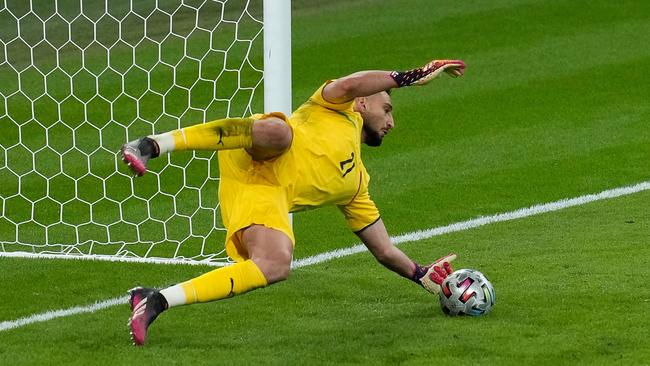 Italy's goalkeeper Gianluigi Donnarumma saves a shot from Spain's forward Alvaro Morata (unseen) in a penalty shootout.