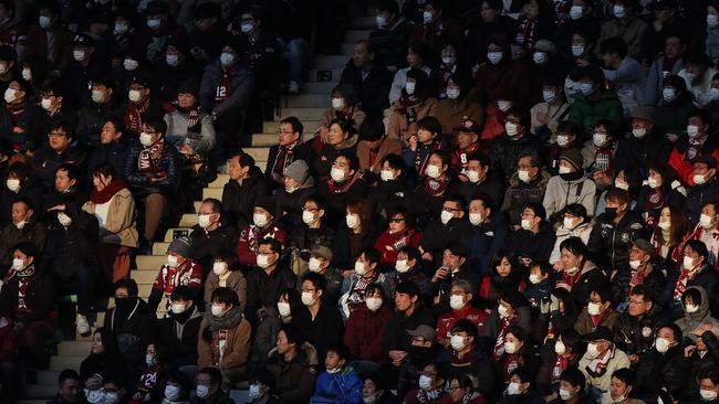 Fans mask up for the J-League return last weekend.