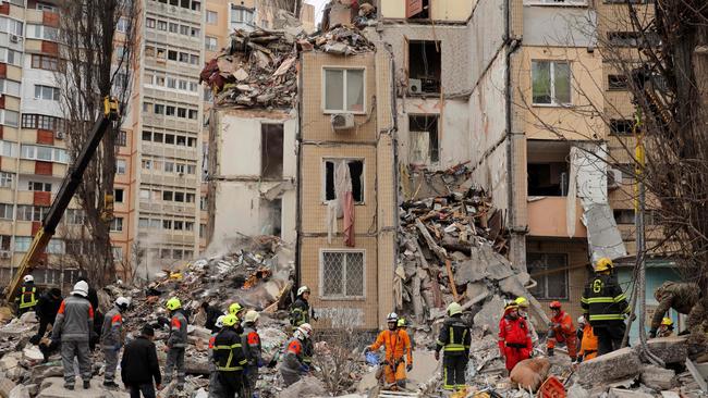 Rescuers work at a heavily damaged multi-story apartment building, following a Russian drone attack, in Odessa. Picture: AFP