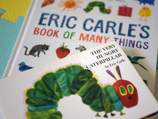 This photo illustration taken on May 26, 2021 shows Eric Carle's "The Very Hungry Caterpillar" and "Book of Many Things" in Los Angeles, California. - Eric Carle, the author of "The Very Hungry Caterpillar," died on May 26, 2021 in Northampton, Massachusetts. He was 91. (Photo by - / AFP) / RESTRICTED TO EDITORIAL USE - MANDATORY MENTION OF THE ARTIST UPON PUBLICATION - TO ILLUSTRATE THE EVENT AS SPECIFIED IN THE CAPTION