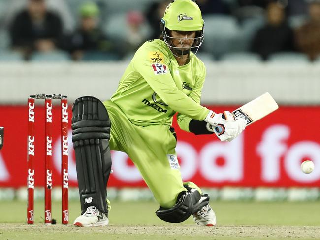 CANBERRA, AUSTRALIA - DECEMBER 22: First gamer Oliver Davies of the Thunder bats during the Big Bash League match between the Sydney Thunder and the Perth Scorchers at Manuka Oval, on December 22, 2020, in Canberra, Australia. (Photo by Darrian Traynor/Getty Images)