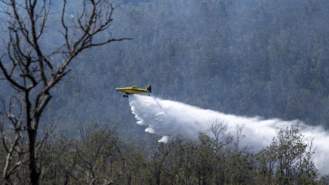 Water bomber plane tends to bushfire burning in Jubilee Park on Toowoomba's range. Saturday. 26th Sep 2020